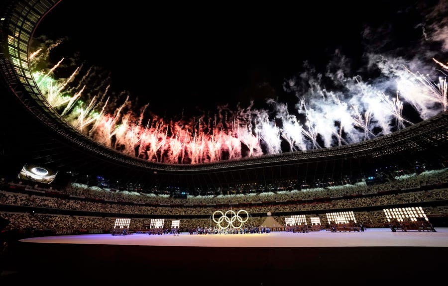 Fireworks above the stadium as the Olympic rings are displayed during the opening ceremony for the Tokyo Olympics.