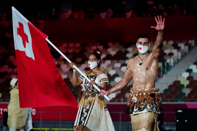 Tonga flag bearers Malia Paseka and Pita Taufatofua during the opening ceremony of the Tokyo 2020 Summer Olympics.
