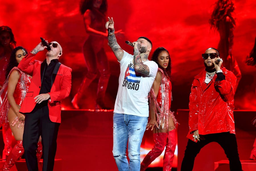 (Left to right) Pitbull, Farruko and El Alfa perform onstage at Premios Juventud 2021 at Watsco Center on July 22, 2021 in Coral Gables, Florida.
