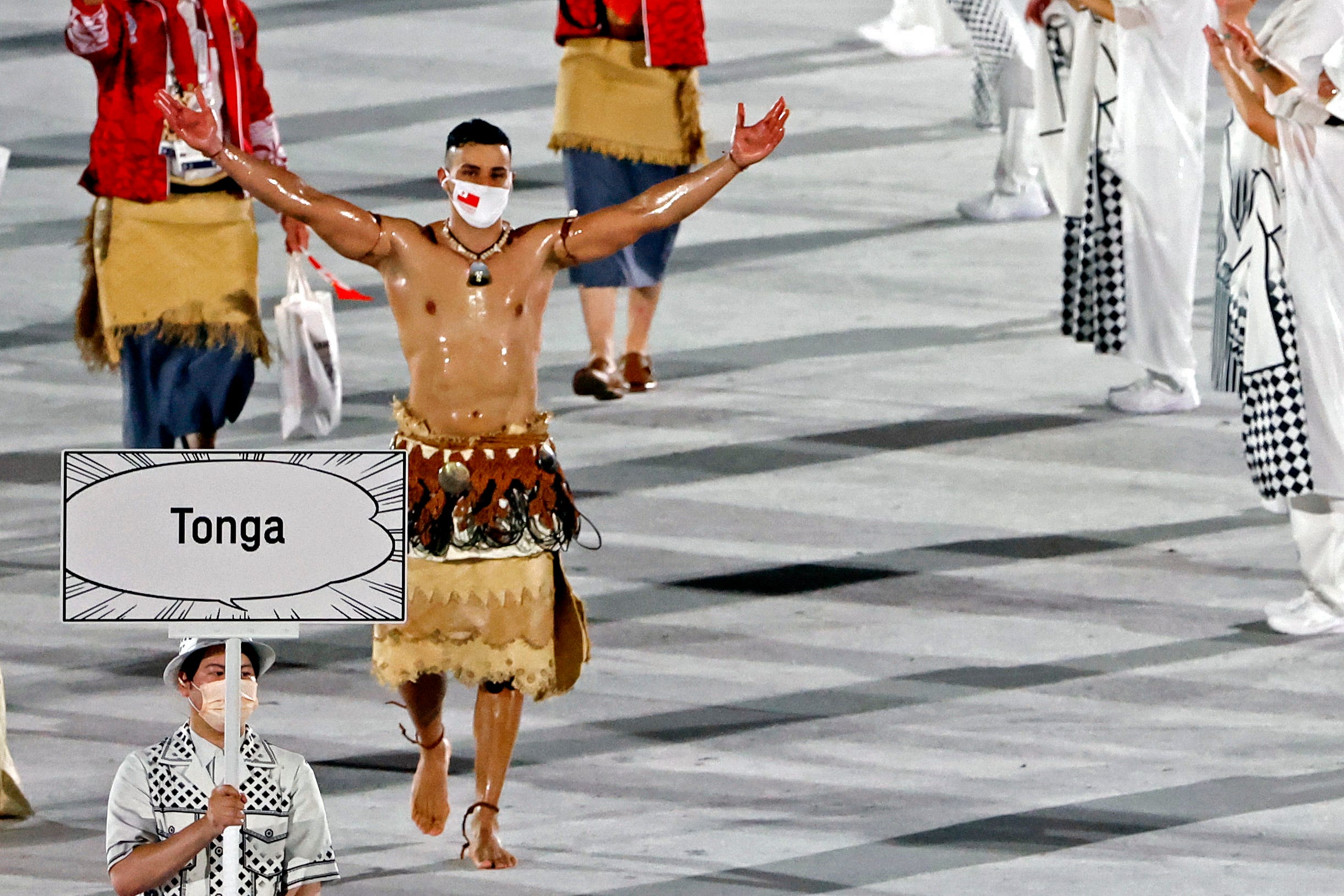 Two shirtless flag bearers for Olympic opening ceremony: Oiled-up Tongan joined by Vanuatu rower