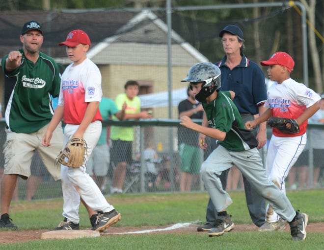 Jewett City All Star Bradley Rush heads for home after the controversial obstruction play during the Little League Sectional 4 Championship game Friday in Mansfield. The game was called due to darkness.