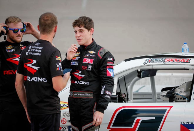 Driver Nick Sanchez of Miami speaks with his team prior to the start of the ARCA Menards Series Shore Lunch 150 race on Saturday, July 24, 2021, at the Iowa Speedway in Newton. Sanchez won the Henry Ford Health 200 race Saturday at Michigan International Speedway.
