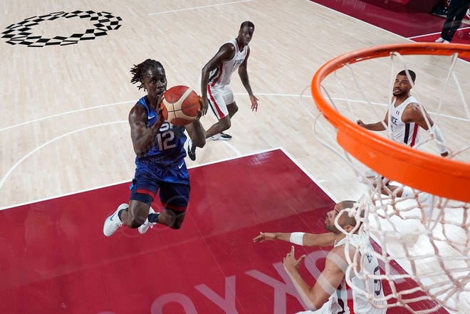 Bucks guard Jrue Holiday goes  in for two of his 18 points during the U.S.'s 83-76 loss to France  in the team's first game of the Tokyo Olympics.