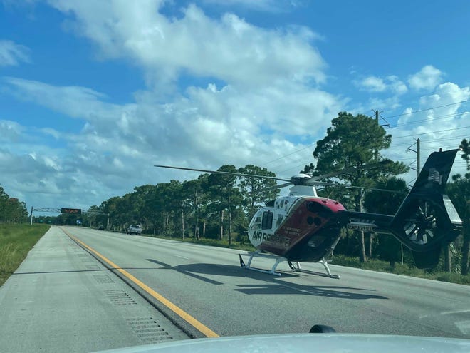 An air rescue helicopter sits on Interstate 95 after a two-vehicle car crash shut down Interstate 95 Sunday night near County Road 512 in Indian River County.