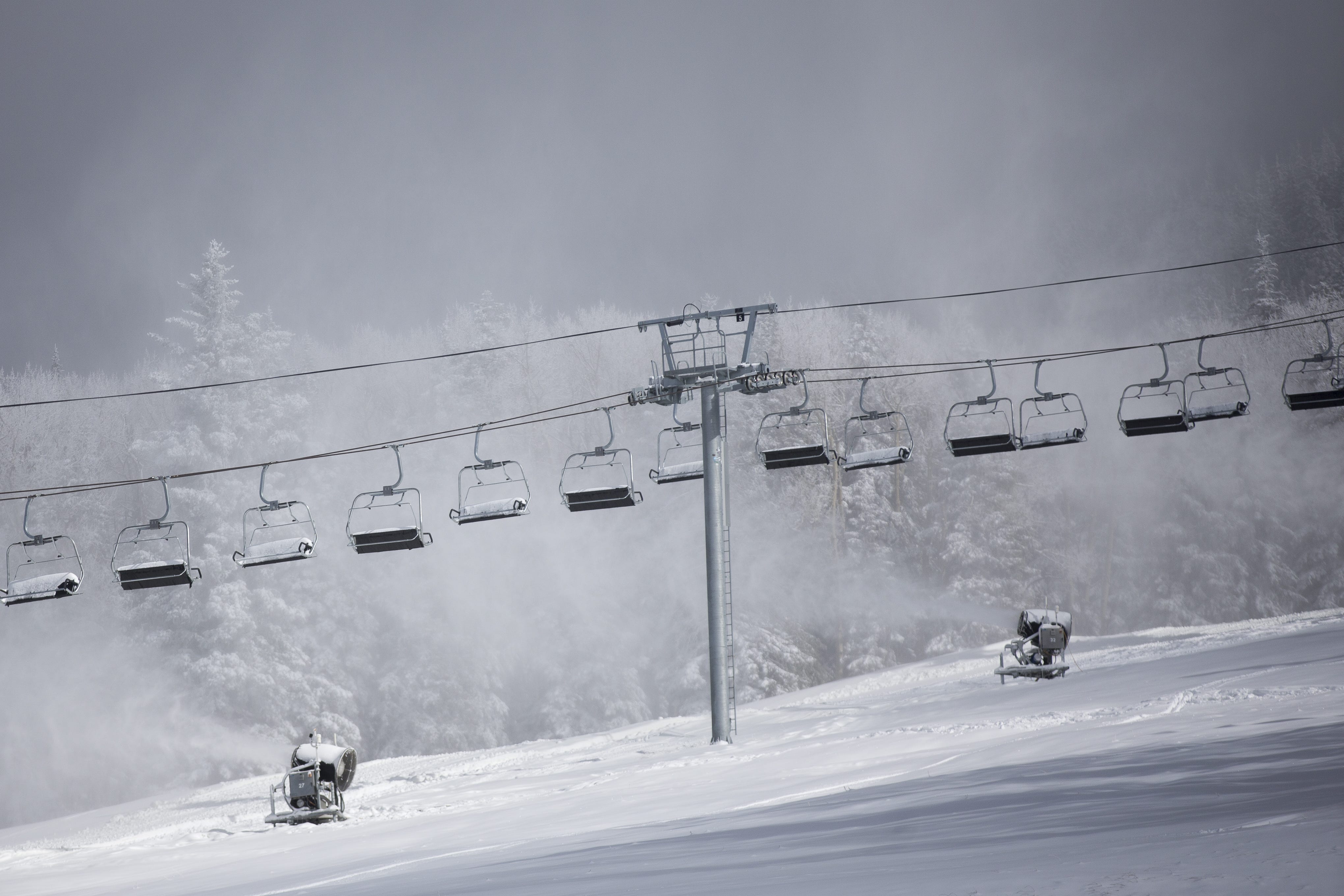 Machines blow artificial snow over Arizona Snowbowl in 2019. The ski resort uses reclaimed wastewater to make snow for its slopes.