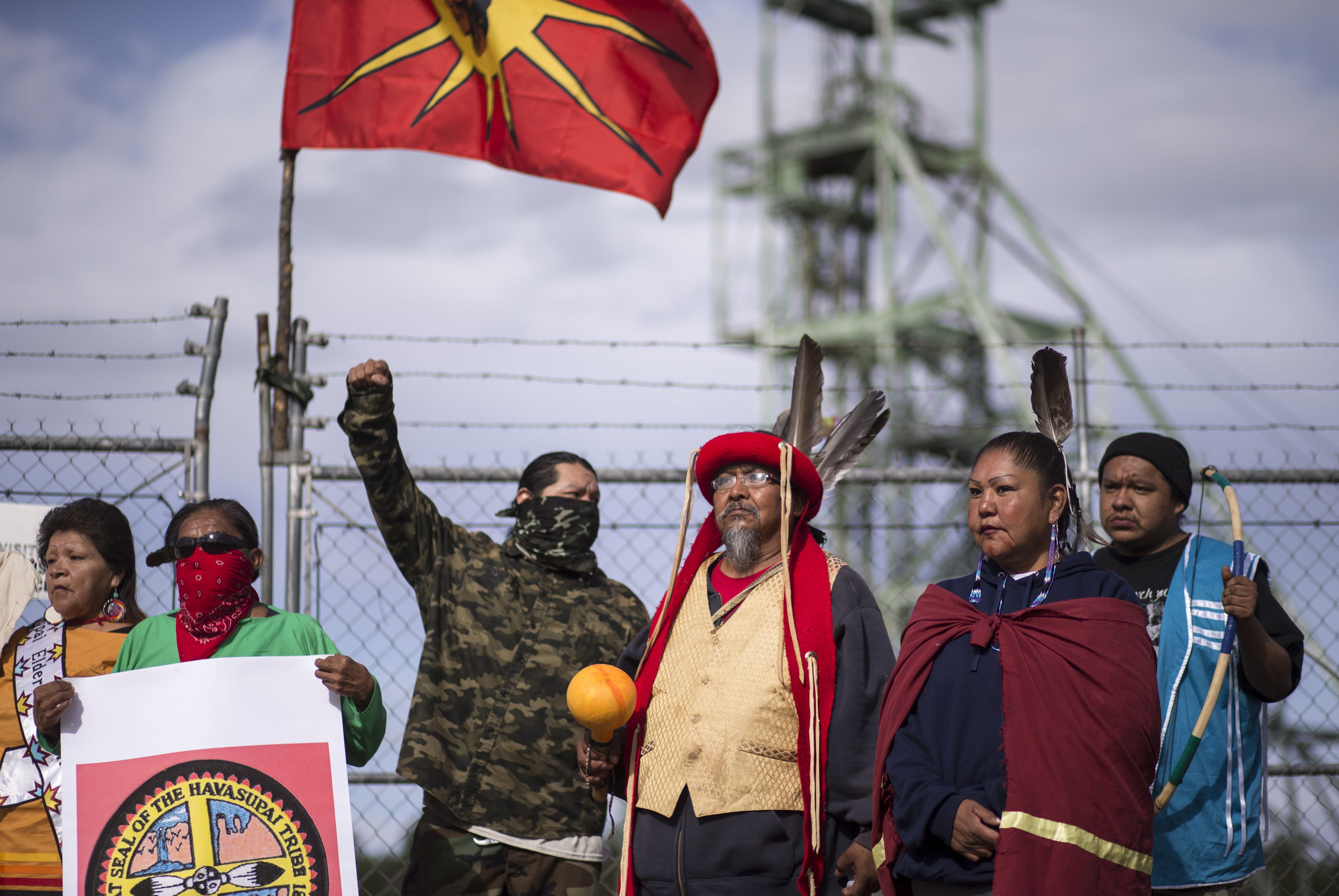 Fydel Rising Sun (center) and others protest mining at Canyon Mine on Oct. 6, 2018, during the Havasupai Tribe's Intertribal Spiritual Gathering. A consortium of tribes and environmentalists are asking the Biden administration to toughen mine permit regulations.