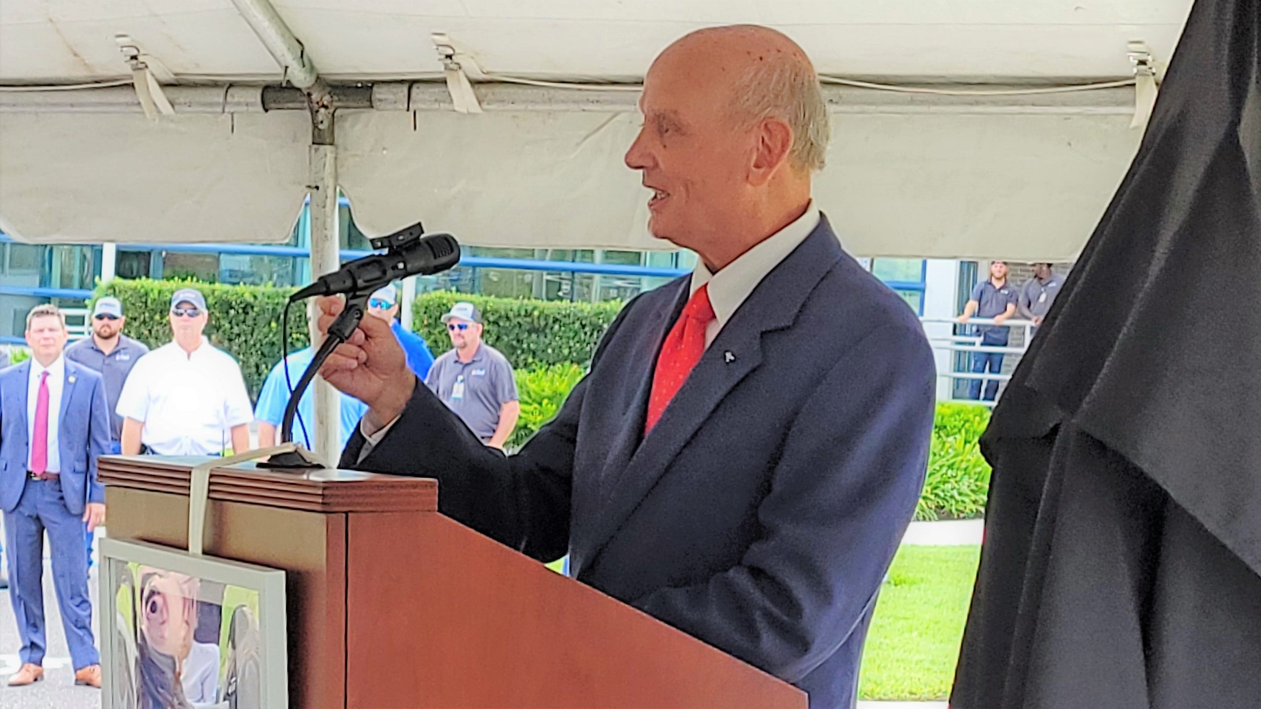 Retired veteran NAS astronaut Norman Thagard speaks at the grand opening of the Cecil Spaceport control tower that bears his name.