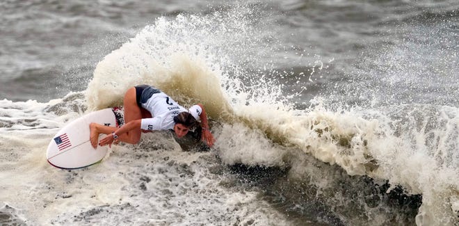 Caroline Marks maneuvers on a wave during the quarterfinals of the women's surfing competition.