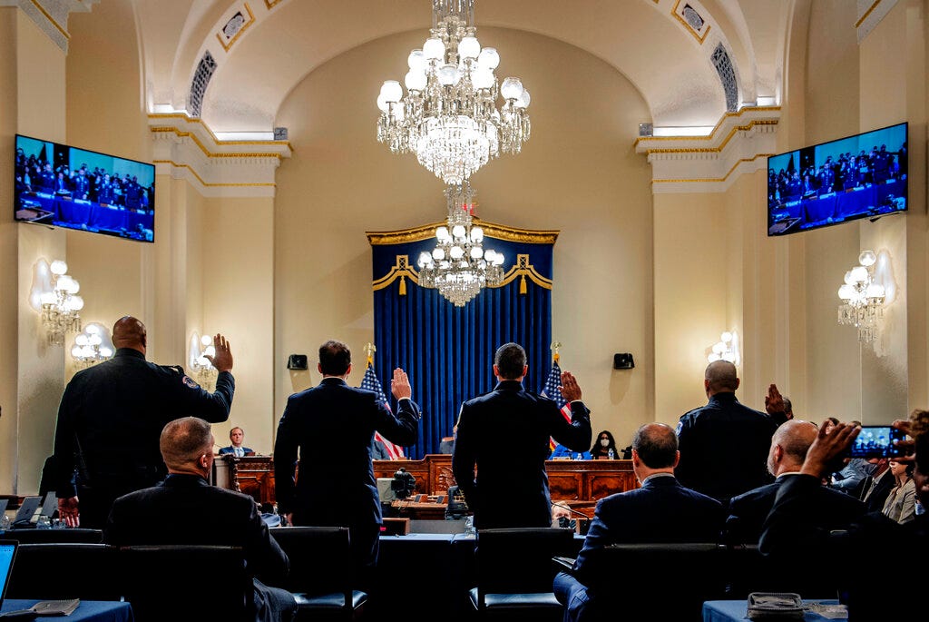 From left, U.S. Capitol Police Sgt. Harry Dunn, Washington Metropolitan Police Department officer Daniel Hodges, Washington Metropolitan Police Department officer Michael Fanone and U.S. Capitol Police Sgt. Aquilino Gonell are sworn in to testify to the House select committee hearing on the Jan. 6 attack on Capitol Hill in Washington, on July 27, 2021