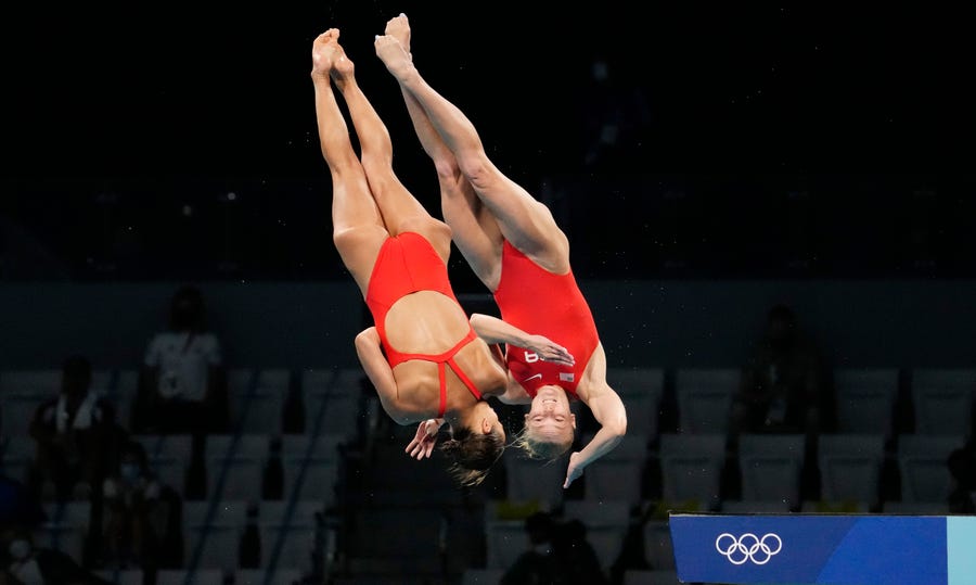 Jessica Parratto and Delaney Schnell compete in the women's 10-meter platform synchronized diving competition.