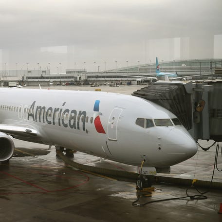 An American Airlines 737-800 aircraft sits at a gate at Chicago's O'Hare International Airport on January 29, 2013.