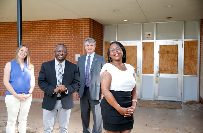 From left to right; Caylee Dodson, Restore OKC Director, Anthony Taylor, Restore OKC Community Director, Allison Vaughn, Restore OKC Parent Advisory Committee Chairwoman, Tony Shinn, President of Bank of America of Oklahoma City, pose for a photo at the building that once housed Polk Elementary School and Justice Alma SeeWorth Academy in Oklahoma City, Wednesday, July 28, 2021.