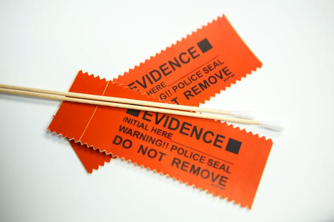 In this 2018 photo, swabs and evidence tags that are part of a rape kit sit on a table in one of the YWCA's exam rooms in Oklahoma City. A recent security breach at a company the Oklahoma City Police Department used to process rape kits may have compromised personal and medical information of sexual assault victims.