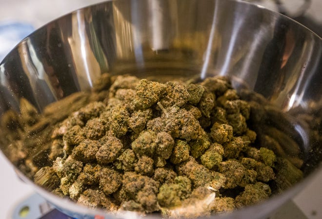 Marijuana is weighed last year at the ReLEAF Center in Niles, one of the dispensaries that will be at the Niles Cannabis Music Festival on Saturday.