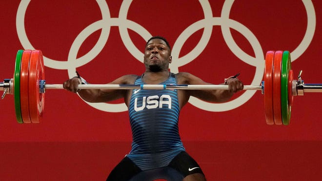United States weightlifter CJ Cummings of Beaufort, S.C., competes in the men's 73kg division at the Summer Olympics on Wednesday, July 28, 2021, in Tokyo, Japan.
