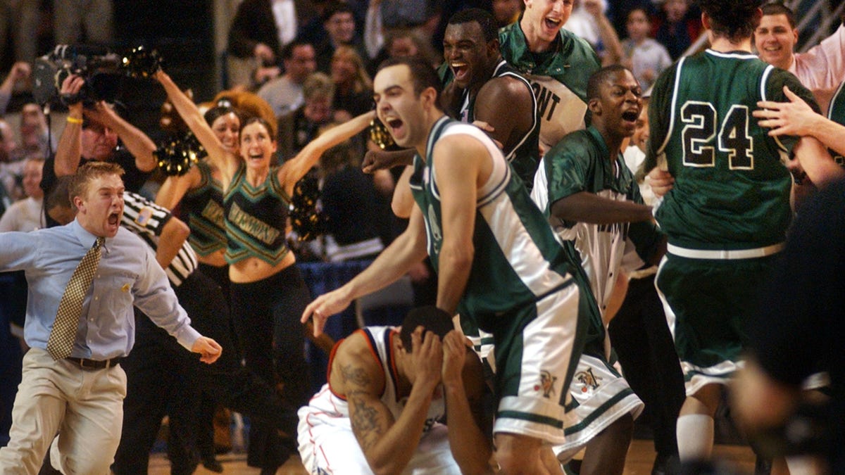 Vermont Catamounts fans and players rejoice after defeating Syracuse, 60-57, in overtime, in the first round of the NCAA tournament at the DCU Center in 2005.