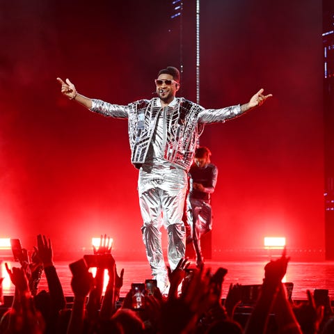 Usher performs at the grand opening of 