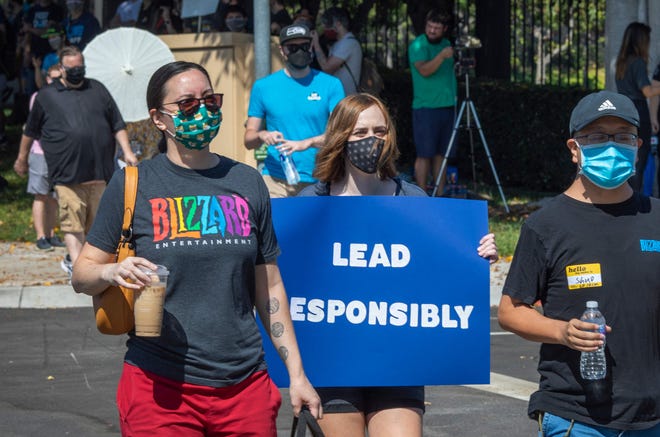 Employees of the video game company Activision Blizzard hold a walkout and protest rally to denounce the company's response to a California Department of Fair Employment and Housing lawsuit and to call for changes in conditions for women and other marginalized groups, in Los Angeles on July 28, 2021.