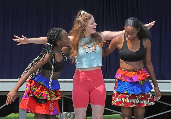Riyonna Kellaware, from left, Katarina Lee, and Victoria Campbell perform an interactive program with members of Inlet Dance Theatre and Djapo Cultural Arts Institute of Cleveland.