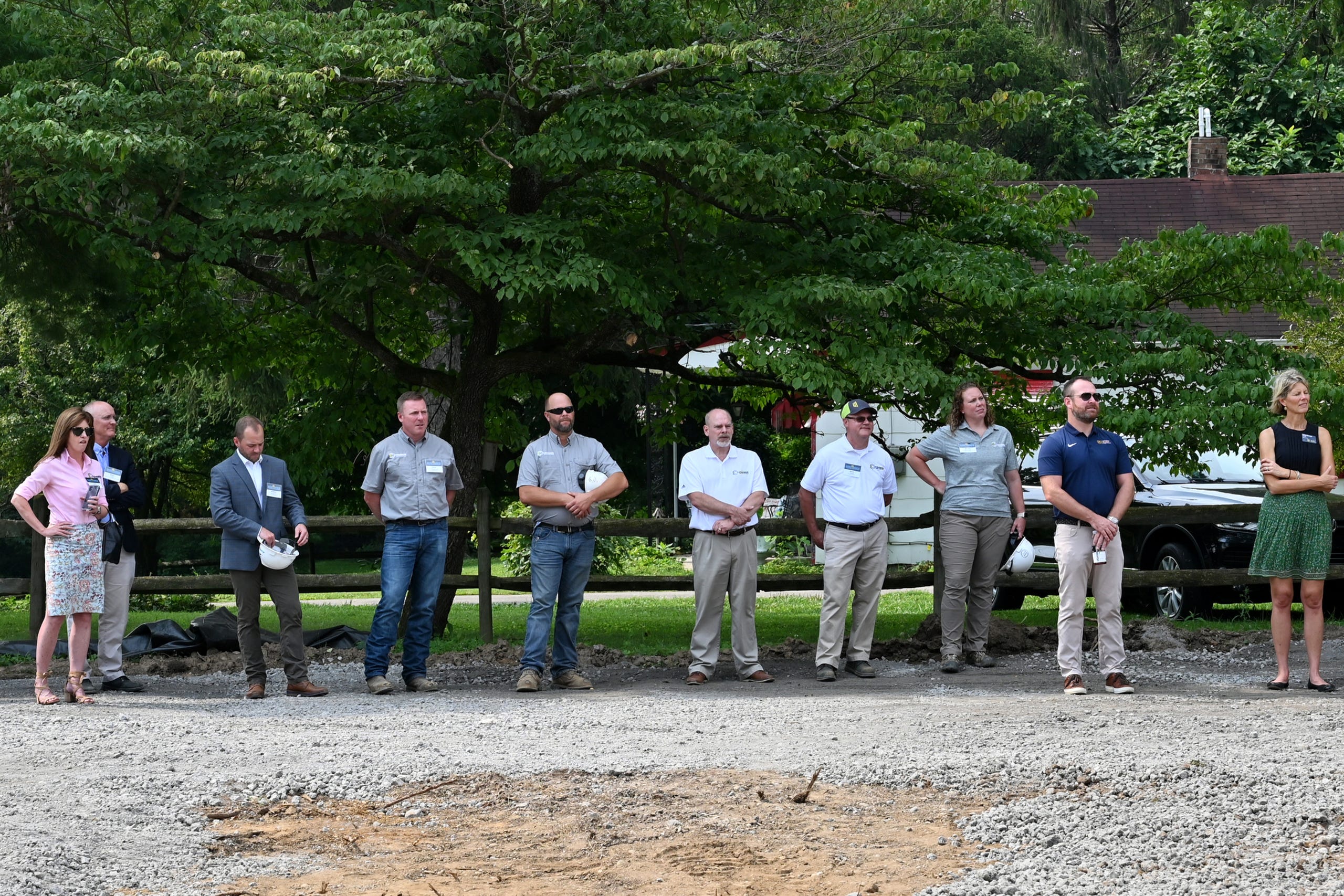 People listen to speakers at the groundbreaking of the Moeller Athletic Complex on Thursday, July 29, 2021 in Miami Township. The complex will feature a baseball stadium, honor wall, practice fields, locker rooms, weight room, athletic offices and batting cages.