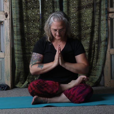Dr. Tracey Ulshafer does her Yoga workout in her H