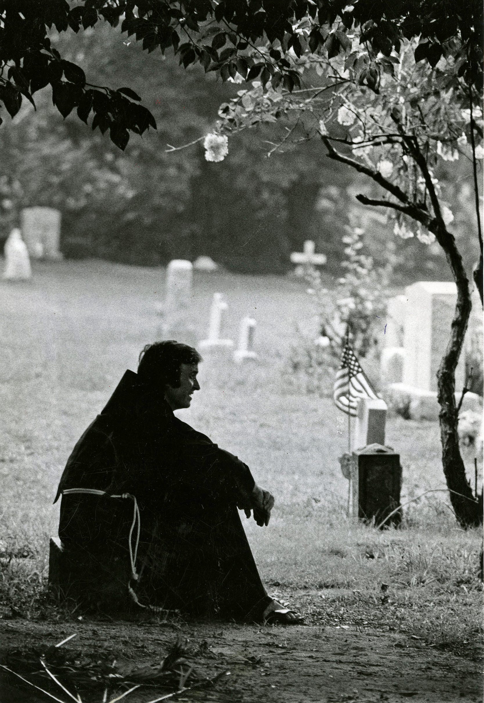 Father Mychal Judge, like St. Francis, the founder of his Franciscan order, tries to spread peace, joy, hope and love as he brings his church to the people - whether they are cemetery workers in Lyndhurst, N.J, teens relaxing on the friary lawn, or neighborhood youngsters. Wherever he goes, the brown-habited friar, seen here on August 27, 1974, is greeted affectionately as Father Mychal