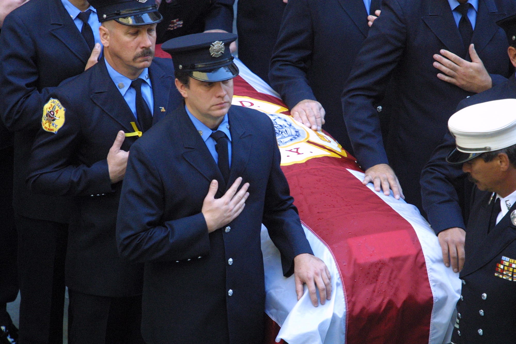 New York City Firefighter poll bearers attend to the casket of NYFD Chaplain Mychal Judge during a funeral mass at St. Francis Church on West 31st Street near 6th Ave. in New York City. Saturday, September 15, 2001.