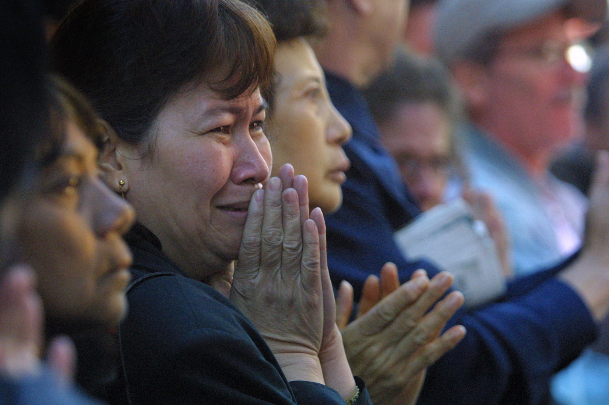 Onlookers weep at the casket of NYFD Chaplain Mychal Judge passes by following a funeral mass at St, Francis Cathedral on West 31st Street near 6th Ave. in NYC. Saturday, September 15, 2001.