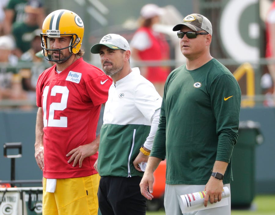 Green Bay Packers quarterback Aaron Rodgers, head coach Matt LaFleur and quarterbacks coach Luke Getsy look on during Wednesday's practice.