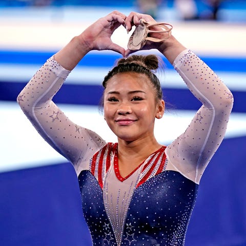 Sunisa Lee reacts in the women's individual all-ar