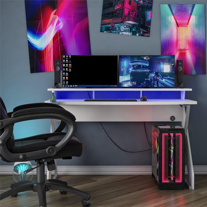 New this summer, Ameriwood Home’s NTense Xtreme Gaming Desk ($195.98 for white, $250.19 for black) offers two levels to set up gear, such as placing monitors and speakers on the back riser and the mouse and keyboard on the main level.