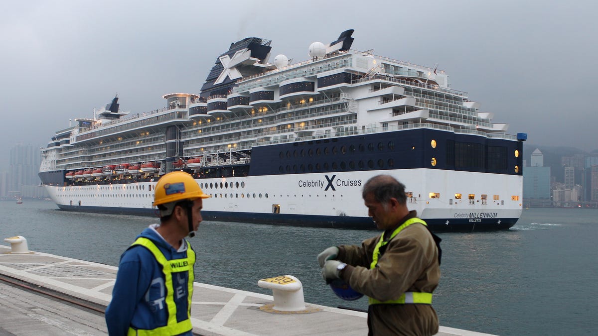 Workers prepared for the arrival of the Celebrity Millennium cruise ship in Hong Kong in this file photo from March 16, 2013.