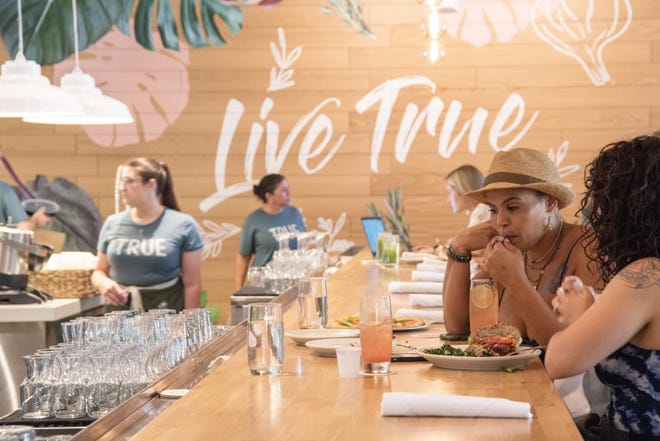 Customers dine at True Food Kitchen's counter during soft-opening hours on Thursday, July 29. The restaurant officially opened the following day at Rosemary Square in West Palm Beach.