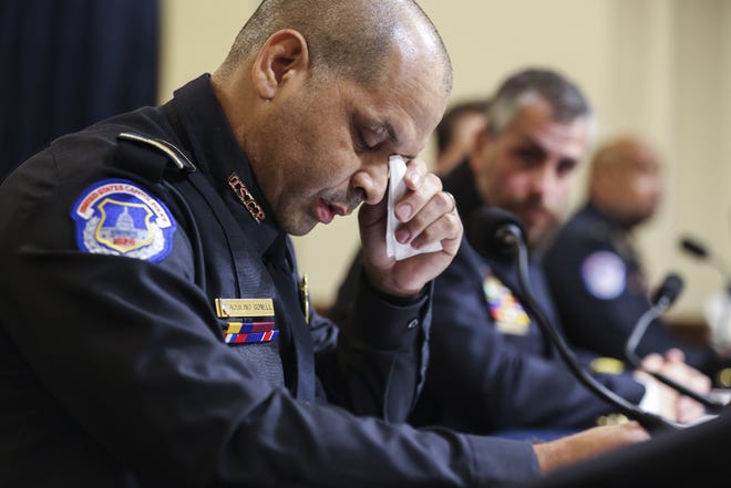 U.S. Capitol Police Sgt. Aquilino Gonell wipes his eye as he testifies during a House select committee hearing on the Jan. 6 attack on Capitol Hill in Washington, Tuesday, July 27, 2021.