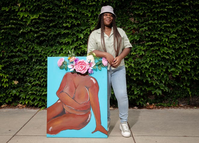 Alyssa Farmer poses with her acrylic and mixed media piece entitled "Self Portrait" in Springfield on July 30. "With all my art I like to show self love," said Farmer. "So this is just kinda like me showing love to myself and kinda putting myself out there." [Justin L. Fowler/The State Journal-Register]