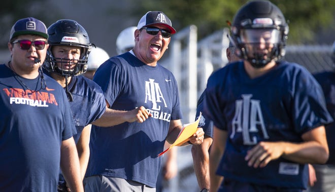 American Leadership Academy Gilbert North head coach Randy Ricedorff gives instructions to the team at the school, Thursday, August 8, 2019.
