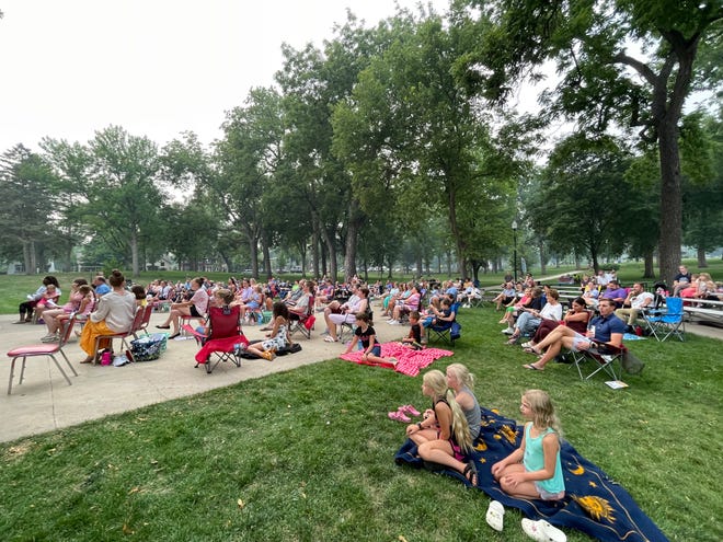The crowd watches Broadway and Beyond at the McKennan Park Band Shell on Thursday July 29, 2021.