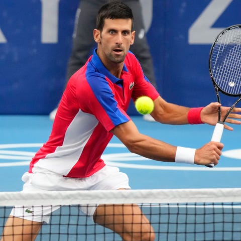 Novak Djokovic returns a shot against Alexander Zv