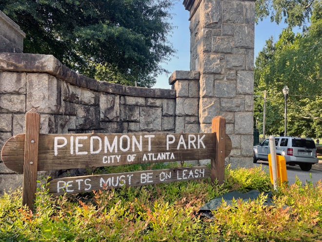 Authorities are searching for the person who fatally stabbed a woman who was walking her dog in Piedmont Park, one of Atlanta's most popular parks.