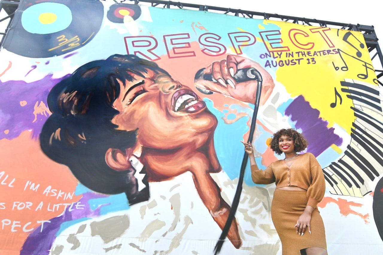 Jennifer Hudson outside the Charles Wright Museum's with a mural by artist Desiree Kelly on Sunday.