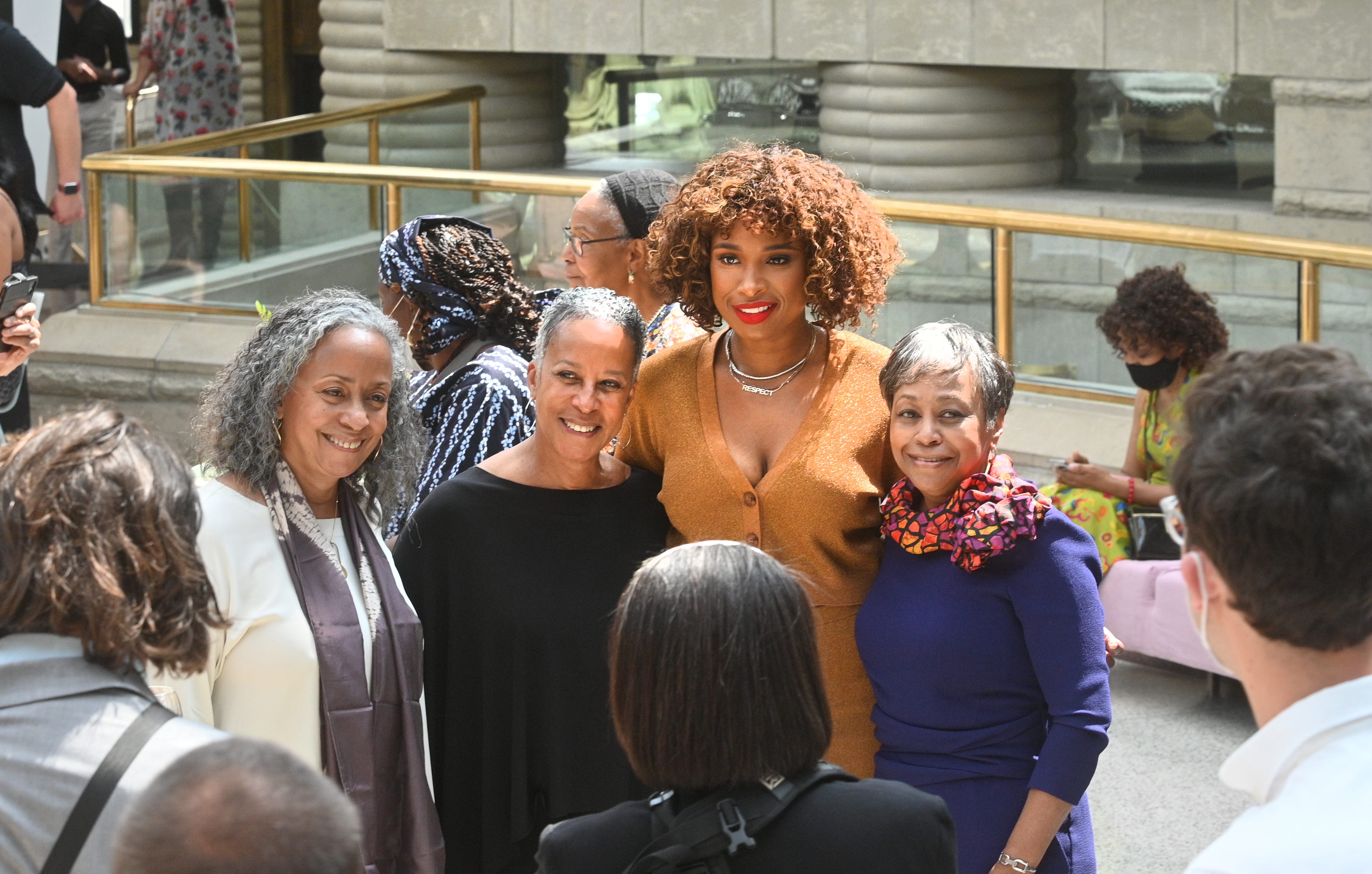 Jennifer Hudson (center) takes a photo with supporters inside the Charles Wright Museum in Detroit .