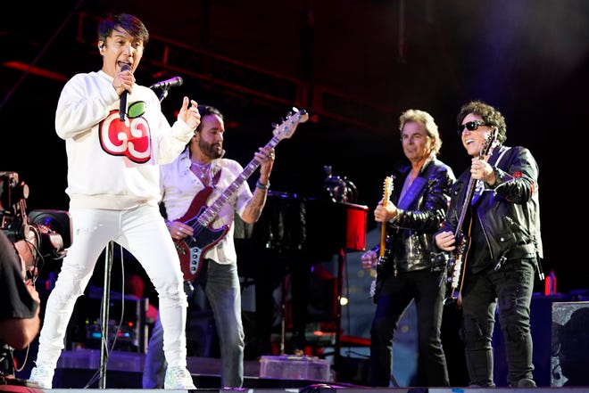 Arnel Pineda, from left, Marco Mendoza, Jonathan Cain, and Neal Schon of the band Journey perform on day three of the Lollapalooza music festival on Saturday, July 31, 2021, at Grant Park in Chicago.