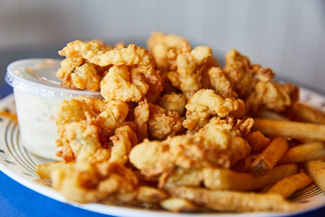 Seafood Sam's Fried Whole Belly Clam Platter comes served with cole slaw and fries. The restaurant has been sourcing their clams from the Kneeland family for 50 years.