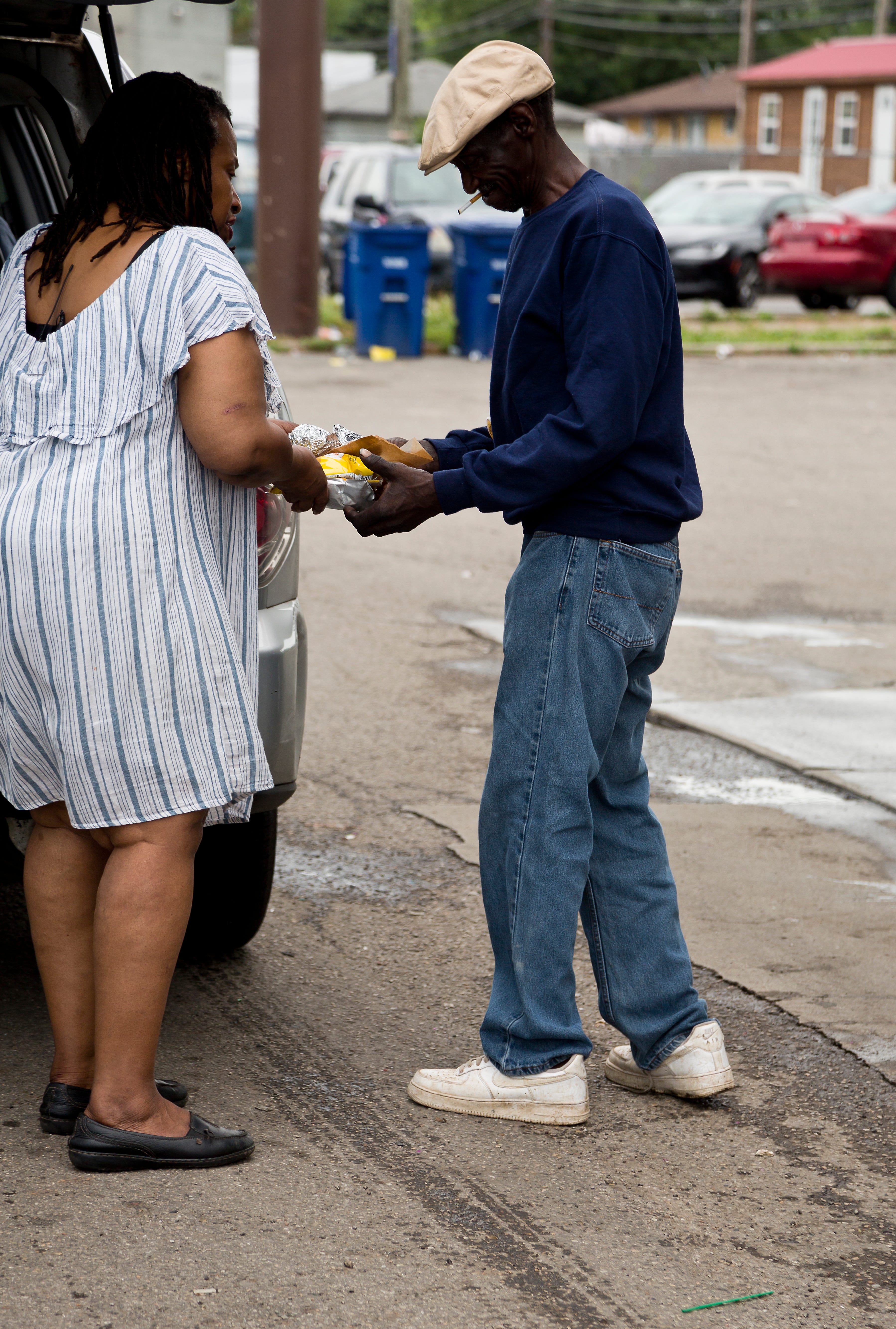 Everyday Hero finalist Debra McCauley hands out food to members of Columbus's homeless population on Thursday, July 1, 2021.