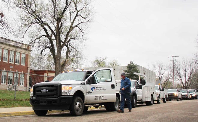 Kansas Gas Service workers survey a potential gas leak in 2016. The company is proposing an upcharge of between $5 and $17 after historically cold temperatures in February.