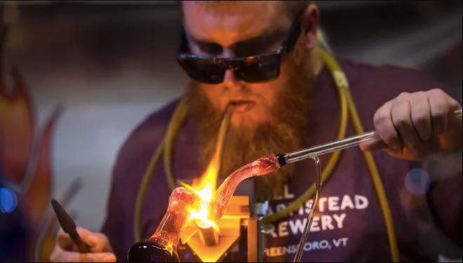 Jeff "Dr. Whitestone" White makes a dry pipe at the Bern Gallery Smoke Shop in Burlington, Vermont in 2016.