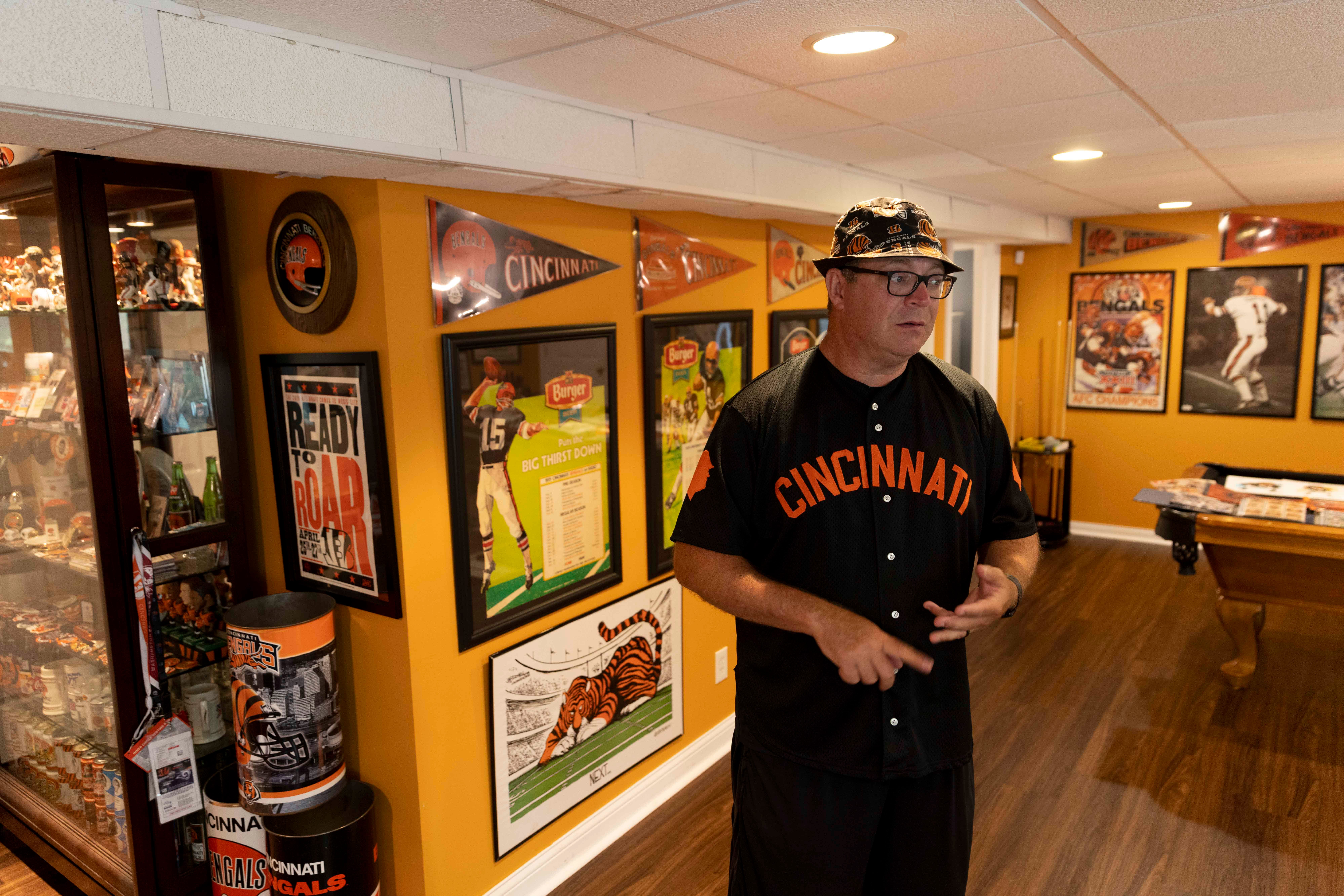 Jim Foster's basement could be called a man cave or a shrine. EIther way, it holds a tone memories, bobbleheads, posters and other assorted black and orange Bengal stuff from his years as a diehard Bengal fan.