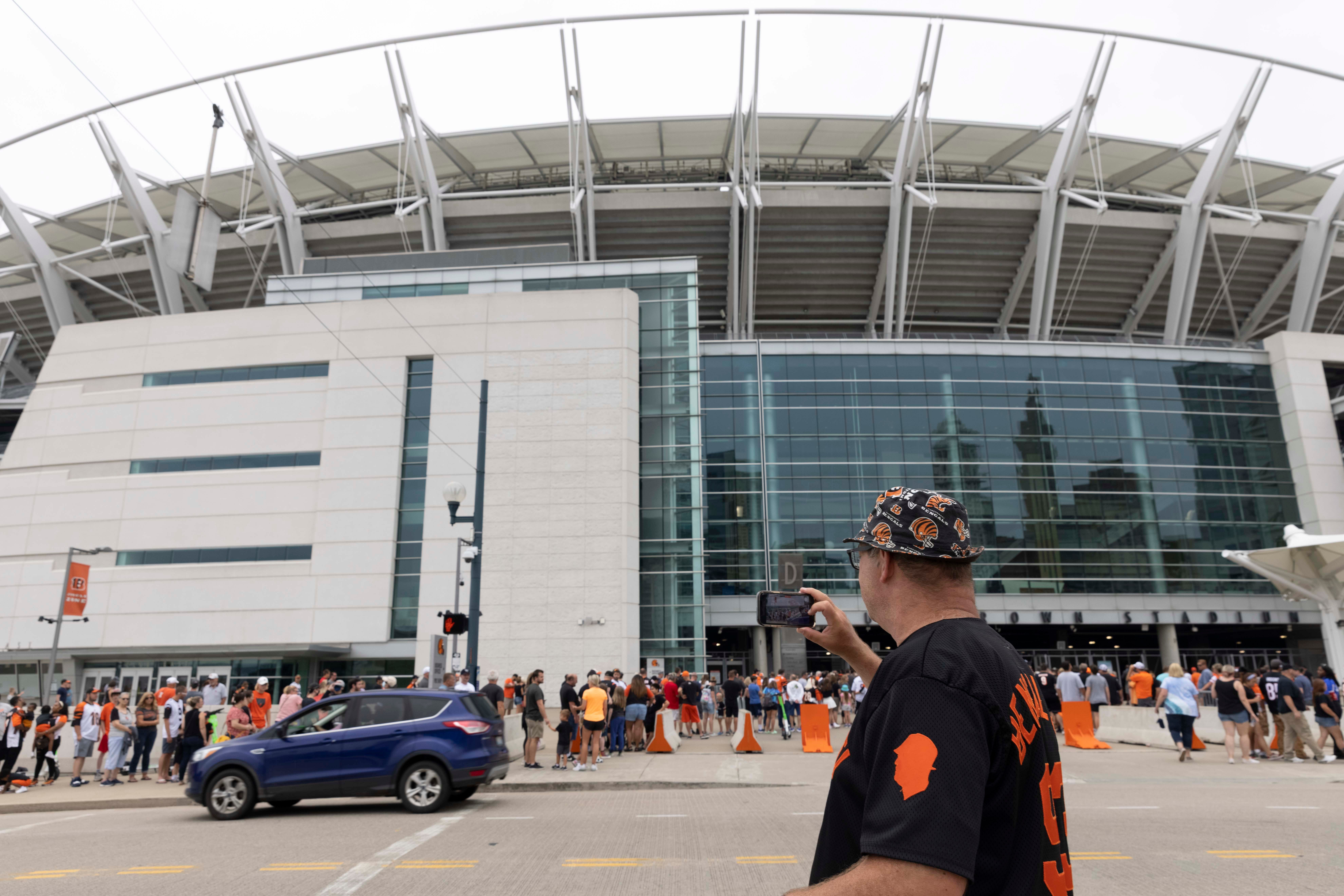 Jim Foster takes a video of the line leading into the Bengals’ Back Together Saturday open practice, Saturday, July 31, 2021, at Paul Brown Stadium in the Downtown neighborhood of Cincinnati, Ohio.Foster, a life-long Bengals fan, has a Bengals YouTube channel, a podcast, a long-running tailgate and a Bengals history museum in his home.