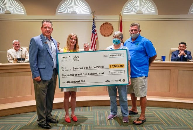 A recent public awareness campaign netted $7,500 for protection of nesting sea turtles. Pictured are Allen Putnam, Beaches Energy (from left); Fran Losito, Shepherd Agency; Jen Burns and Kevin Brown, Beaches Sea Turtle Patrol.