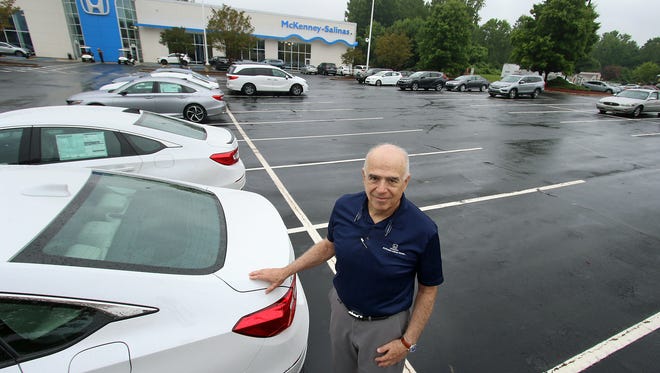 Sal Salinas stands in what is usually a lot filled with new cars Tuesday morning, Aug. 3, 2021, at McKenney-Salinas Honda on East Franklin Boulevard.